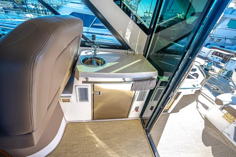  Yacht Photos Pics Interior of 2016 Regal 46 Sport Coupe yacht with sink and countertop.