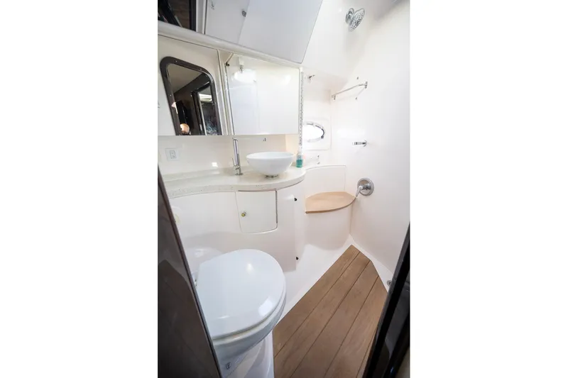  Yacht Photos Pics 2016 Regal 46 Sport Coupe bathroom with modern fixtures and wooden flooring.