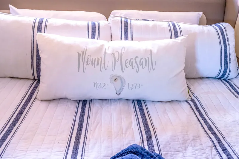  Yacht Photos Pics Luxurious bedding with striped pillows on a 2016 Regal 46 Sport Coupe yacht.