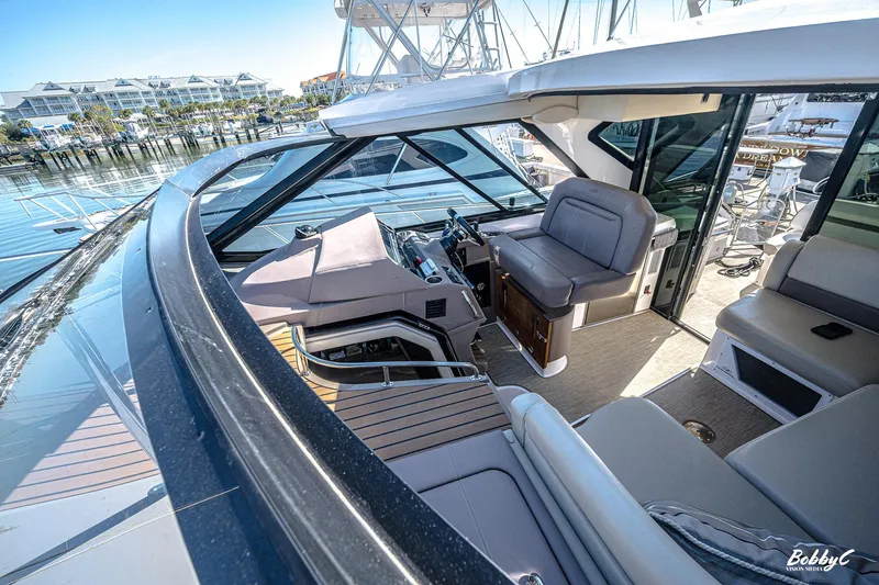  Yacht Photos Pics 2016 Regal 46 Sport Coupe yacht interior with luxurious seating and modern design.