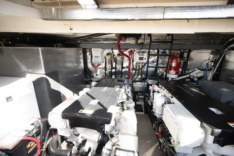  Yacht Photos Pics Engine room of 2016 Regal 46 Sport Coupe with dual engines and fire extinguisher.