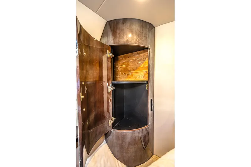  Yacht Photos Pics Open wooden cabinet inside 2016 Regal 46 Sport Coupe yacht interior.