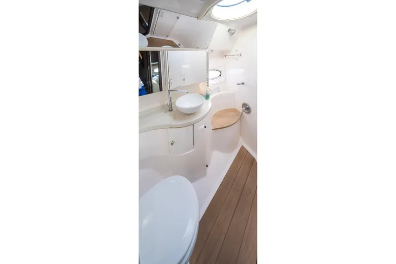  Yacht Photos Pics Luxurious bathroom interior of 2016 Regal 46 Sport Coupe yacht.