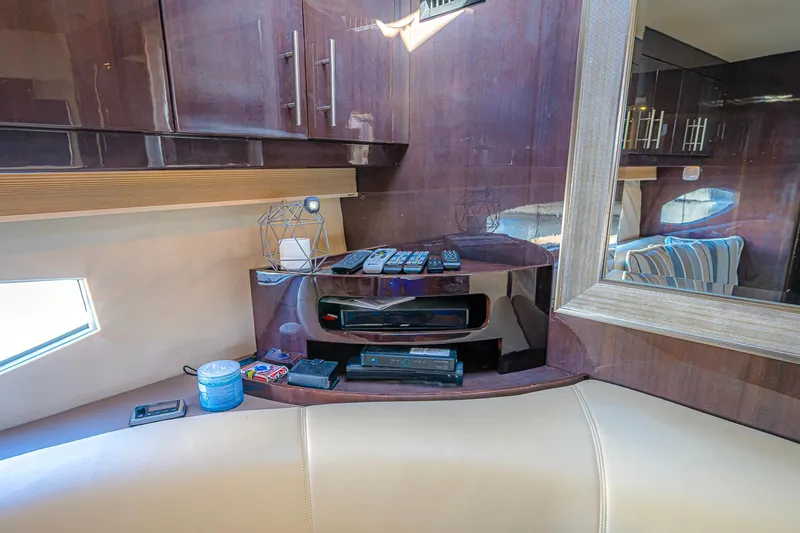  Yacht Photos Pics Interior of 2016 Regal 46 Sport Coupe with modern cabinetry and entertainment setup.