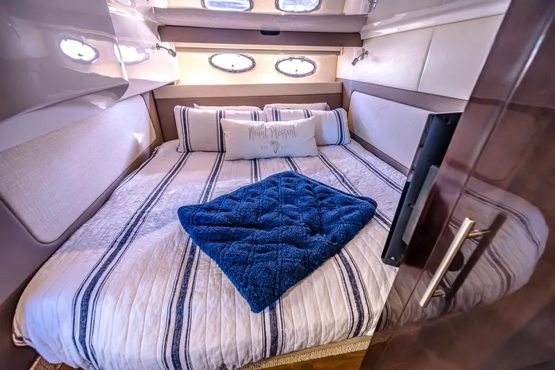  Yacht Photos Pics Luxurious cabin interior of 2016 Regal 46 Sport Coupe with cozy bedding.