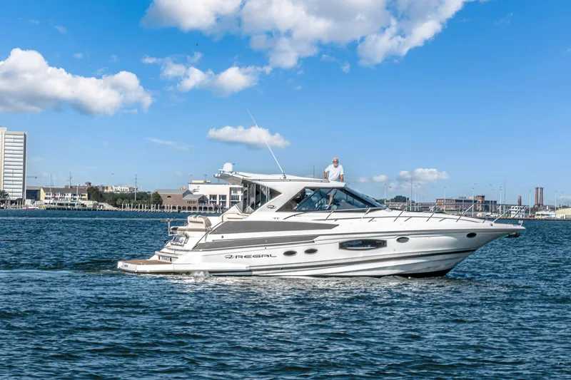  Yacht Photos Pics 2016 Regal 46 Sport Coupe yacht cruising on a sunny day.