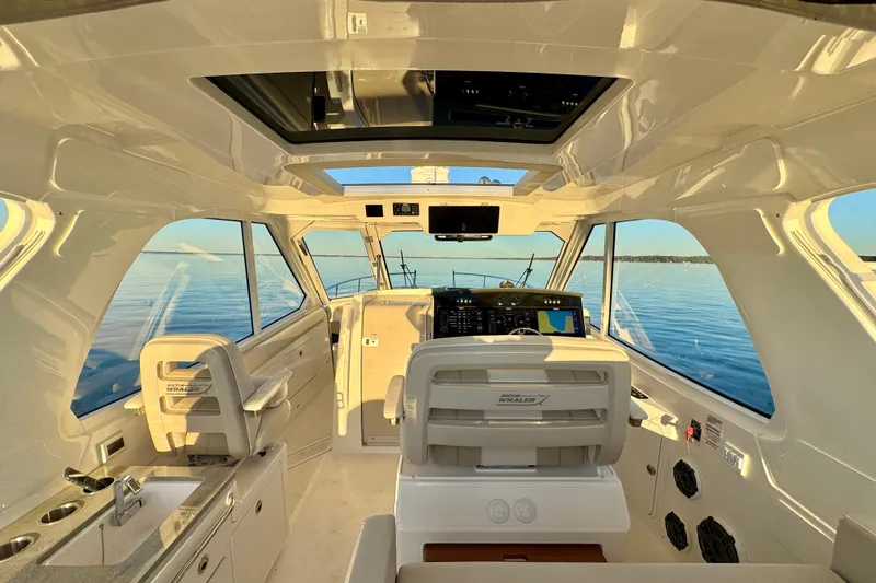  Yacht Photos Pics Interior of 2024 Boston Whaler 380 Realm boat with modern helm and seating.