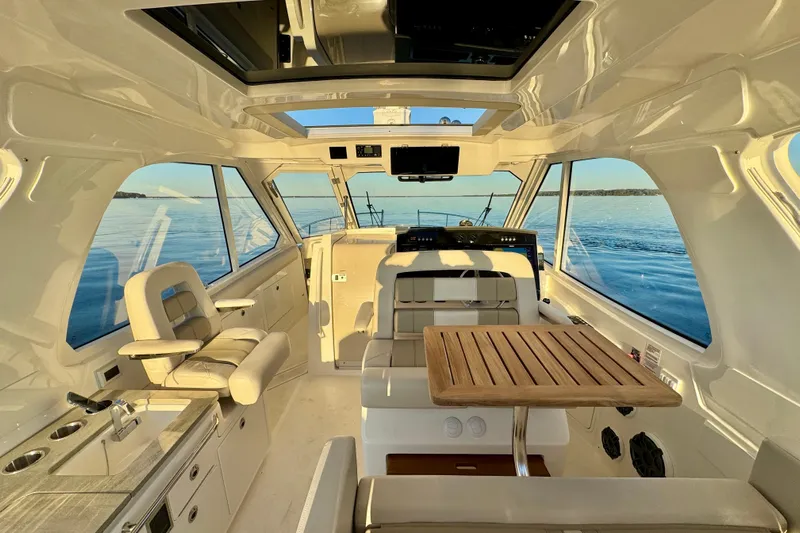  Yacht Photos Pics 2024 Boston Whaler 380 Realm interior with luxurious seating and ocean view.