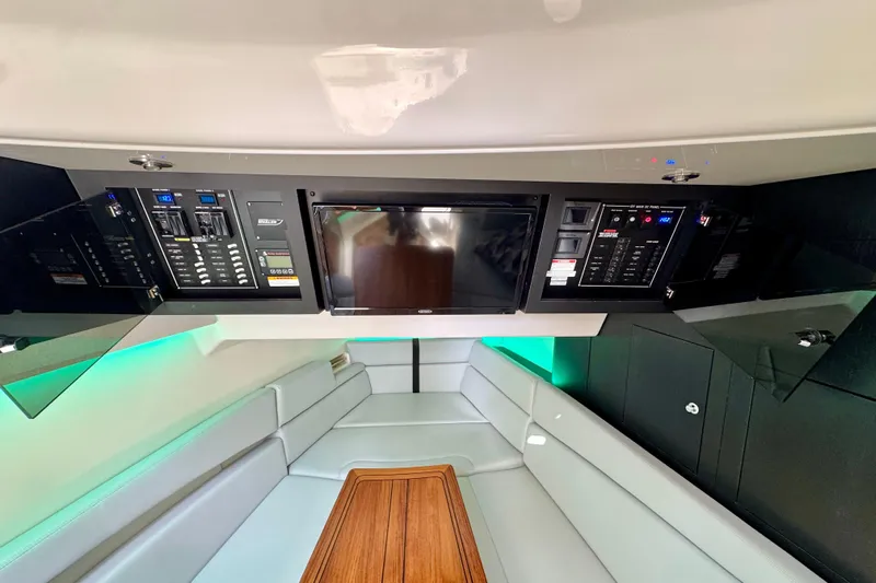  Yacht Photos Pics 2024 Boston Whaler 380 Realm interior with control panels and seating area.