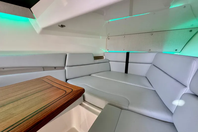  Yacht Photos Pics Luxurious interior of 2024 Boston Whaler 380 Realm with elegant seating and ambient lighting.