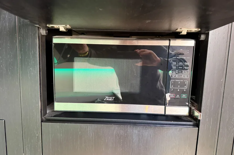  Yacht Photos Pics Microwave oven inside 2024 Boston Whaler 380 Realm boat kitchen area.