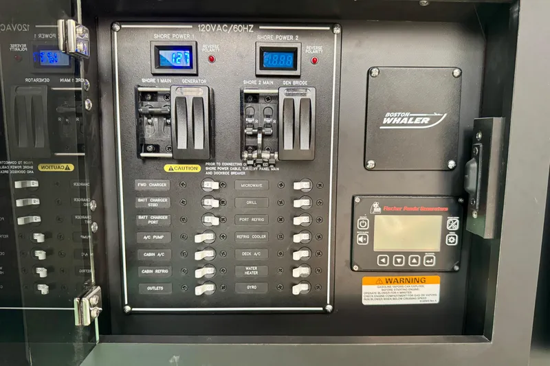  Yacht Photos Pics Electrical panel of 2024 Boston Whaler 380 Realm boat with control switches and display.