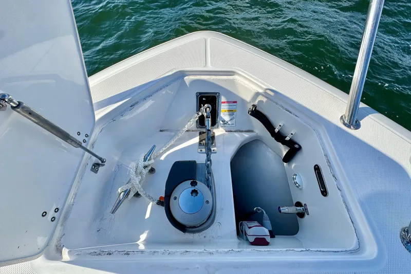  Yacht Photos Pics Boston Whaler 380 Realm 2024 anchor compartment with rope and chain on open water.