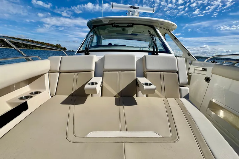  Yacht Photos Pics 2024 Boston Whaler 380 Realm boat interior with luxurious seating and cup holders.