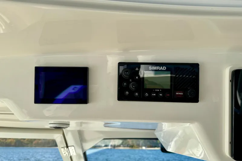  Yacht Photos Pics 2024 Boston Whaler 380 Realm dashboard with Simrad marine electronics display.