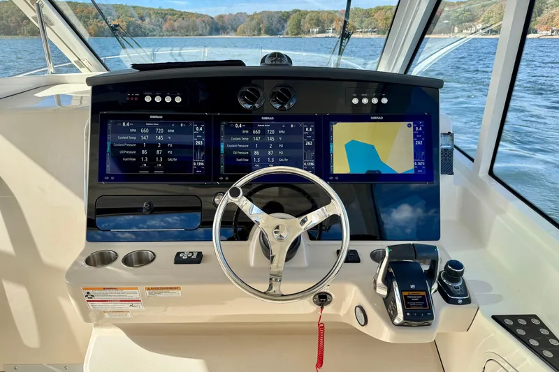  Yacht Photos Pics 2024 Boston Whaler 380 Realm helm with advanced navigation displays and controls.