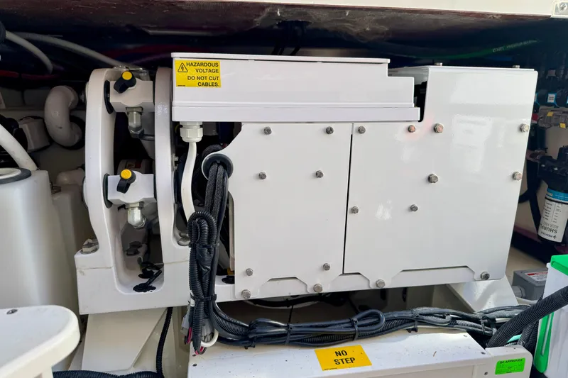  Yacht Photos Pics Engine compartment of 2024 Boston Whaler 380 Realm with electrical components and warning labels.