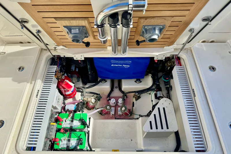  Yacht Photos Pics Engine compartment of 2024 Boston Whaler 380 Realm, showcasing batteries and equipment.