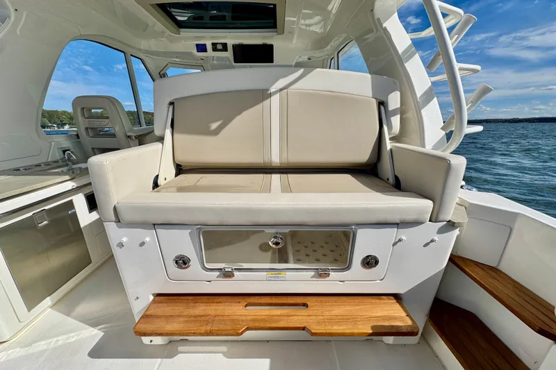  Yacht Photos Pics 2024 Boston Whaler 380 Realm interior with seating and ocean view.