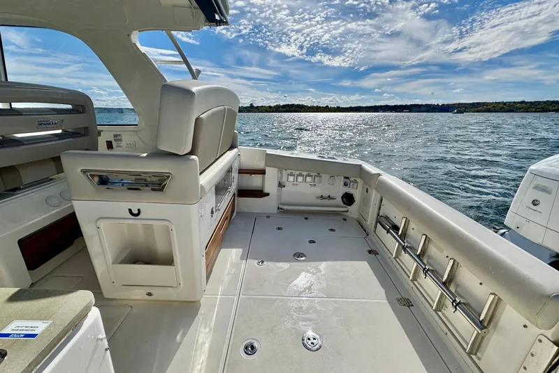  Yacht Photos Pics 2024 Boston Whaler 380 Realm boat interior with ocean view and clear sky.