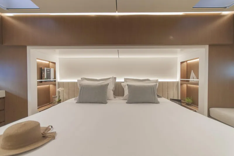 Savoir Faire Yacht Photos Pics Luxurious bedroom interior of 2025 MCP Global Exp 68 yacht with modern design.