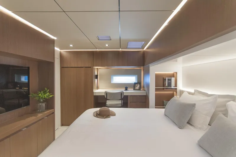 Savoir Faire Yacht Photos Pics Luxurious cabin interior of 2025 MCP Global Exp 68 yacht, featuring modern design and elegant furnishings.