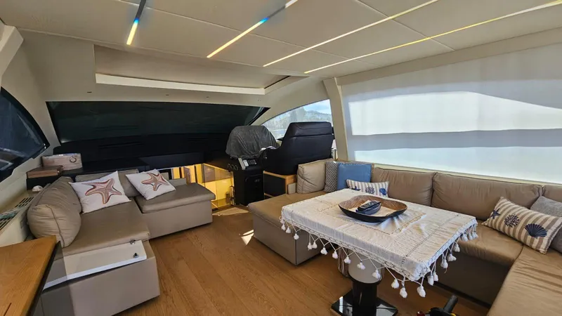  Yacht Photos Pics Luxurious interior of a 2015 Pershing 70 yacht with elegant seating and decor.