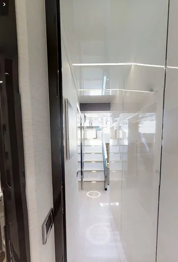  Yacht Photos Pics Interior view of 2015 Pershing 70 yacht, featuring sleek, modern design and glossy finishes.