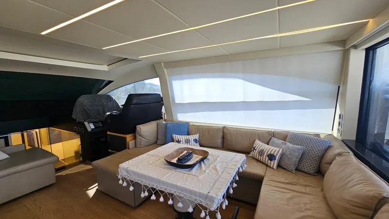  Yacht Photos Pics Luxurious interior of a 2015 Pershing 70 yacht with elegant seating and decor.