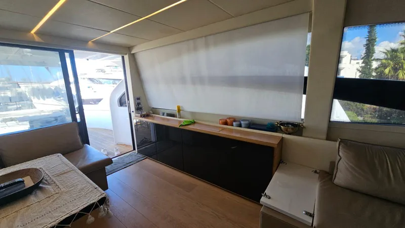  Yacht Photos Pics Interior of 2015 Pershing 70 yacht with modern furnishings and large windows.