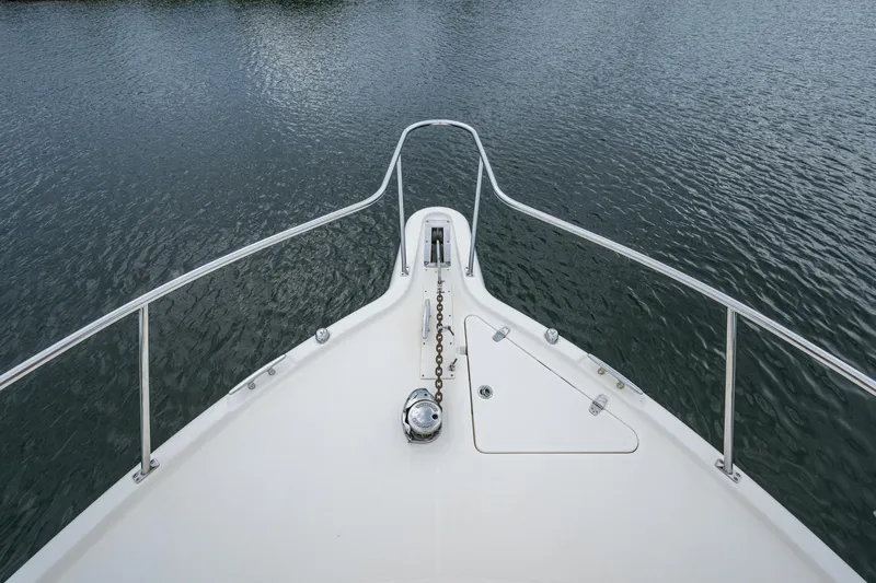Bottoms Up II Yacht Photos Pics Bow view of 2009 Pursuit OS 375 Offshore boat on calm water.