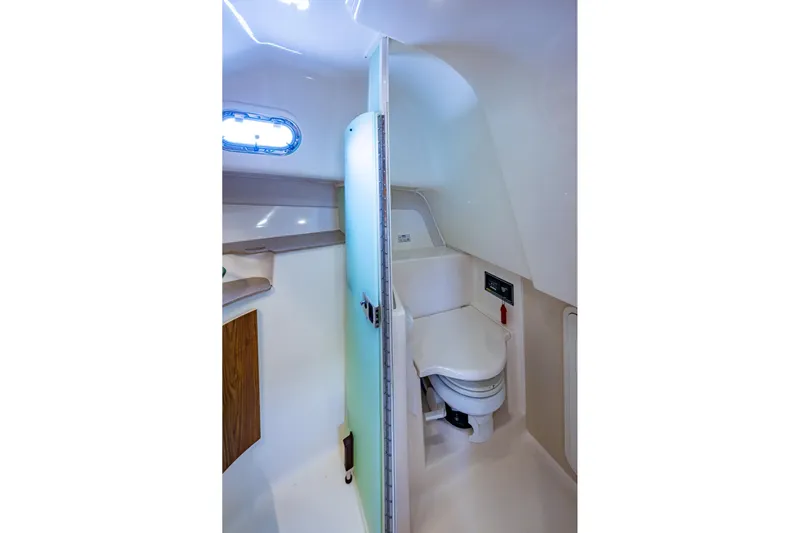 Bottoms Up II Yacht Photos Pics 2009 Pursuit OS 375 Offshore boat bathroom interior with toilet and sink.