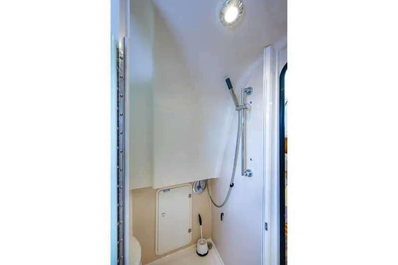 Bottoms Up II Yacht Photos Pics 2009 Pursuit OS 375 Offshore boat shower with modern fixtures and lighting.