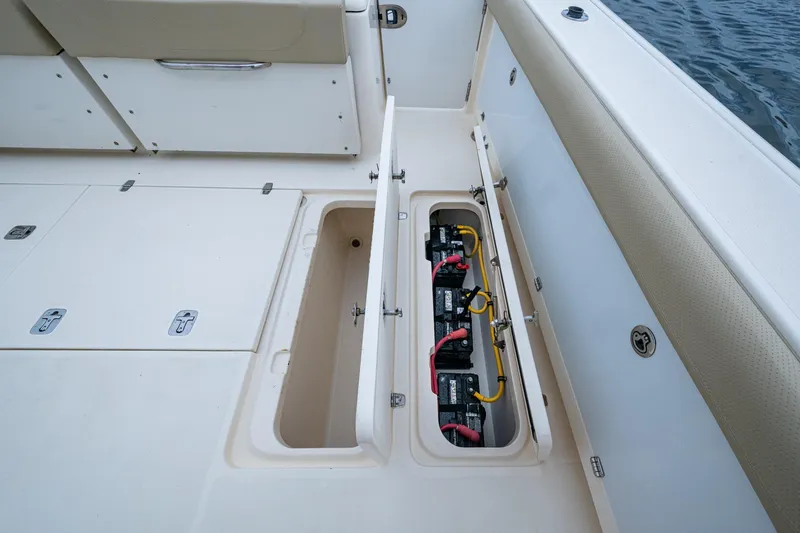 Bottoms Up II Yacht Photos Pics 2009 Pursuit OS 375 Offshore boat showing open battery compartment with wiring.