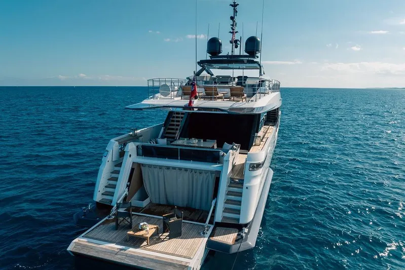 Randy Beth Yacht Photos Pics Luxurious 2018 Custom Line 120 yacht on open sea, featuring spacious deck and modern design.