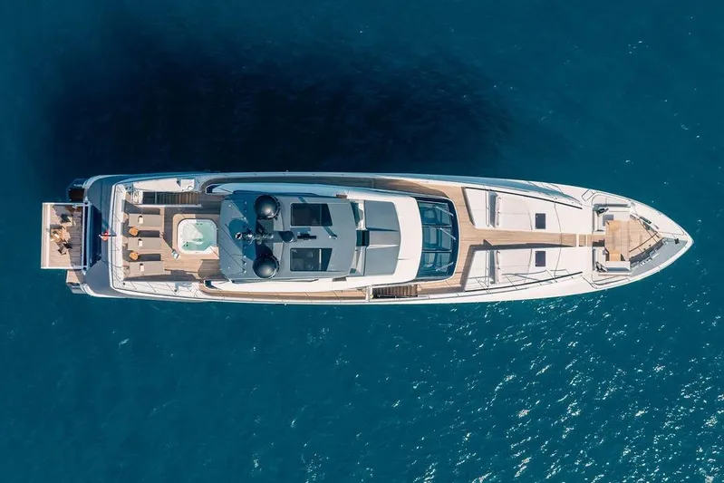 Randy Beth Yacht Photos Pics Aerial view of 2018 Custom Line 120 yacht on blue ocean water.