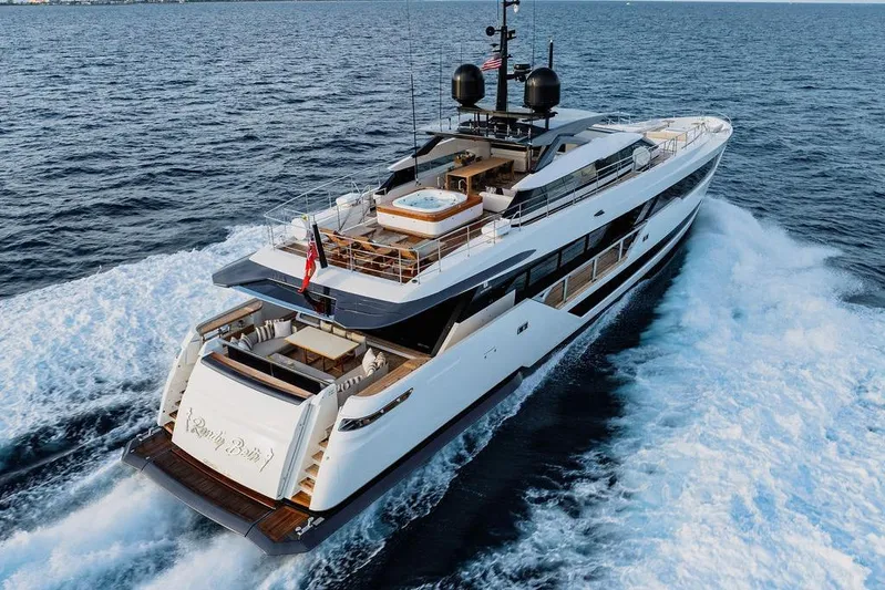 Randy Beth Yacht Photos Pics Luxurious 2018 Custom Line 120 yacht cruising on open sea, featuring elegant design and spacious deck.