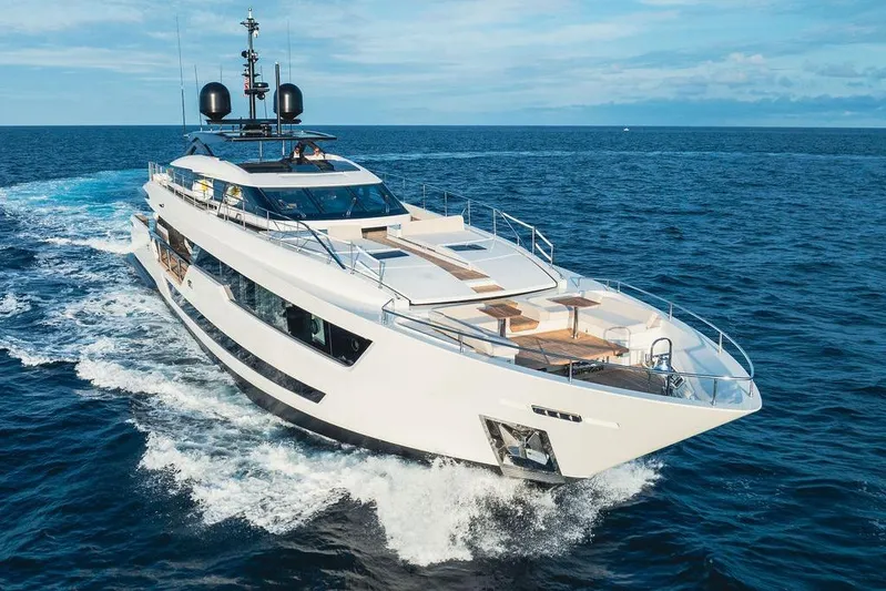 Randy Beth Yacht Photos Pics Luxurious 2018 Custom Line 120 yacht cruising on open sea under clear skies.