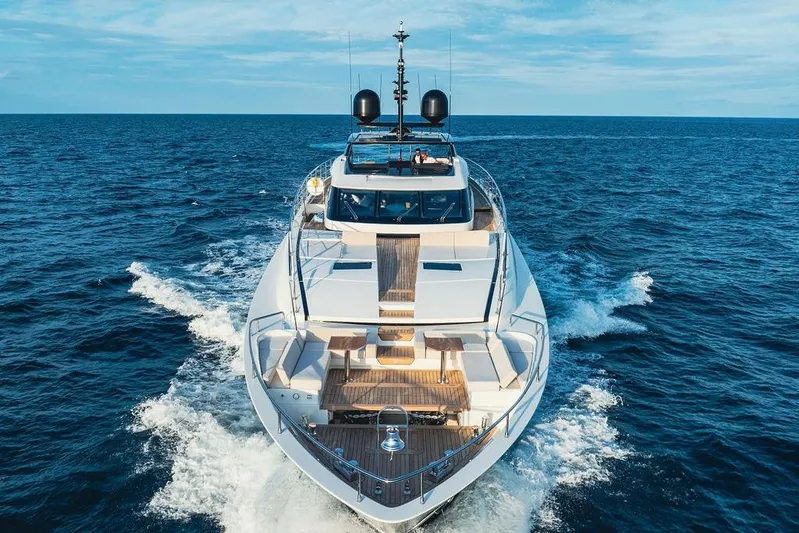 Randy Beth Yacht Photos Pics Luxurious 2018 Custom Line 120 yacht cruising on open sea under clear skies.