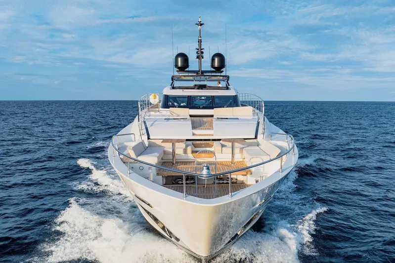 Randy Beth Yacht Photos Pics Luxurious 2018 Custom Line 120 yacht cruising on open sea under clear blue sky.