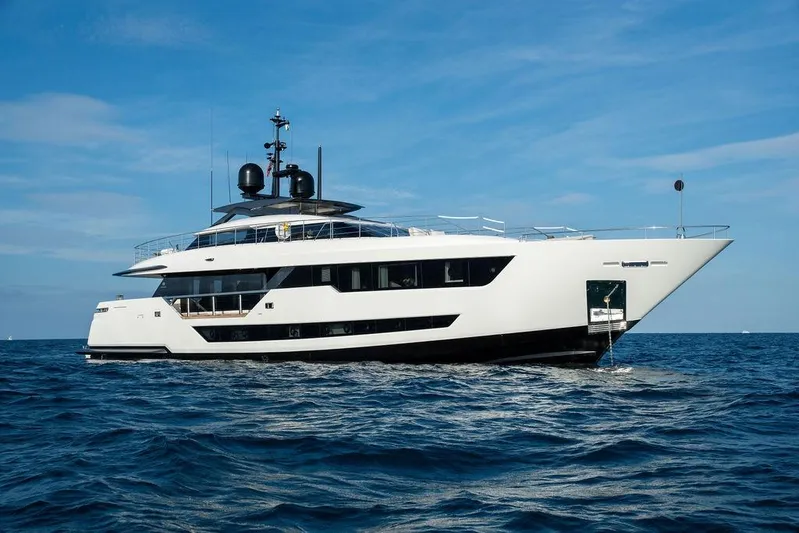 Randy Beth Yacht Photos Pics Luxurious 2018 Custom Line 120 yacht cruising on open sea under clear blue sky.
