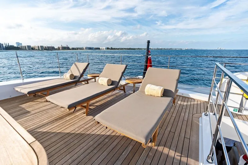 Randy Beth Yacht Photos Pics Luxurious 2018 Custom Line 120 yacht deck with sun loungers and ocean view.