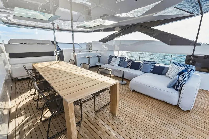 Randy Beth Yacht Photos Pics Luxurious 2018 Custom Line 120 yacht deck with elegant seating and dining area.