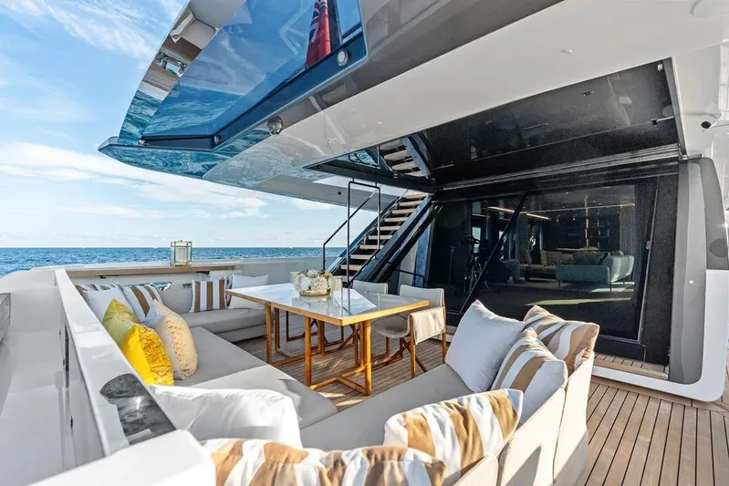Randy Beth Yacht Photos Pics Luxurious 2018 Custom Line 120 yacht deck with elegant seating and ocean view.