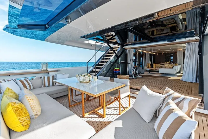 Randy Beth Yacht Photos Pics Luxurious 2018 Custom Line 120 yacht with elegant outdoor seating and ocean view.