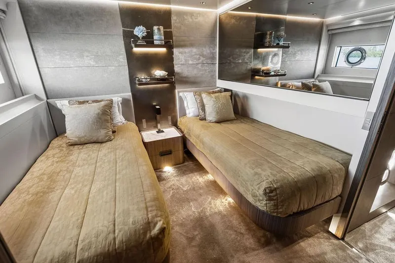Randy Beth Yacht Photos Pics Luxurious twin bedroom on 2018 Custom Line 120 yacht, featuring elegant decor and modern amenities.