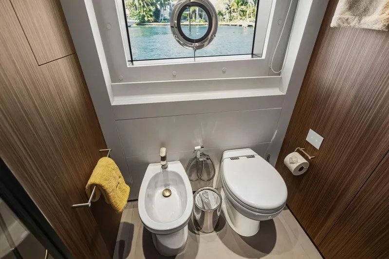 Randy Beth Yacht Photos Pics Luxurious yacht bathroom with toilet, bidet, and ocean view window, Custom Line 120, 2018 model.