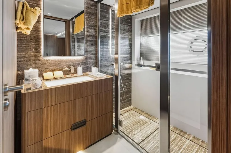 Randy Beth Yacht Photos Pics Luxurious 2018 Custom Line 120 yacht bathroom with modern wood and marble design.