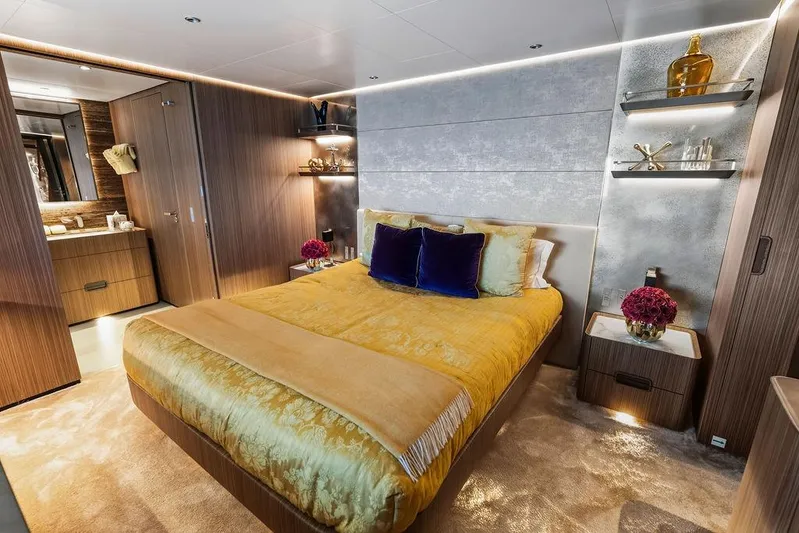 Randy Beth Yacht Photos Pics Luxurious yacht bedroom with elegant decor, featuring a plush bed and modern furnishings, Custom Line 120, 2018.