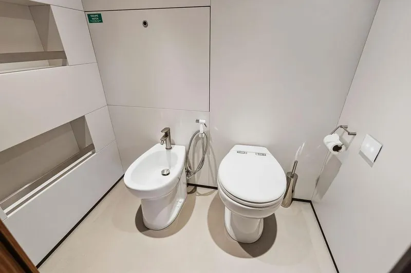 Randy Beth Yacht Photos Pics Modern bathroom with toilet and bidet on a Custom Line 120 yacht, 2018 model.